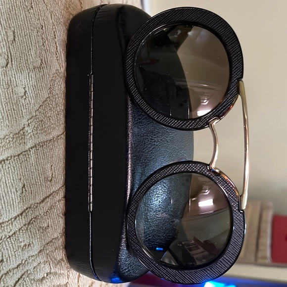 Stunning sunglasses by Prada in Black! Authentic! Excellent condition! Worn once